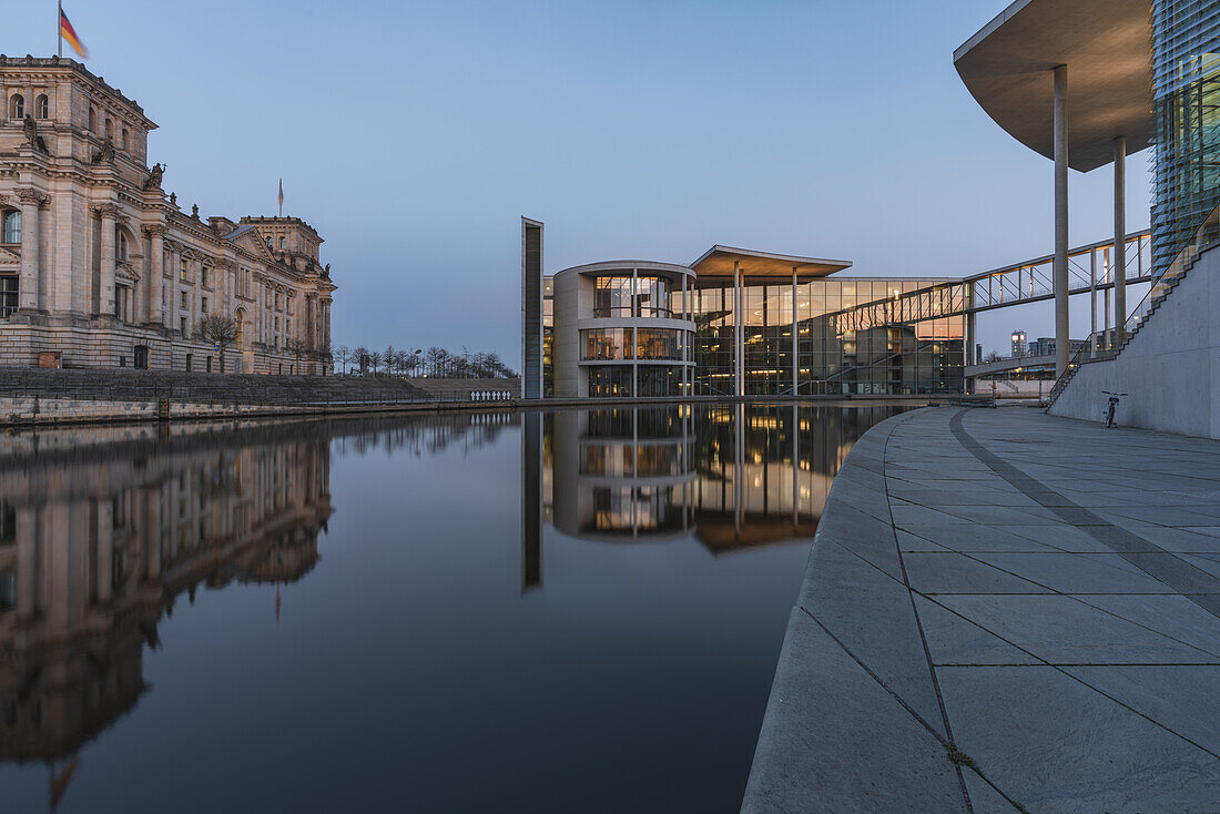 Early morning in the government district with a view of the Reichstag in Berlin, Germany.