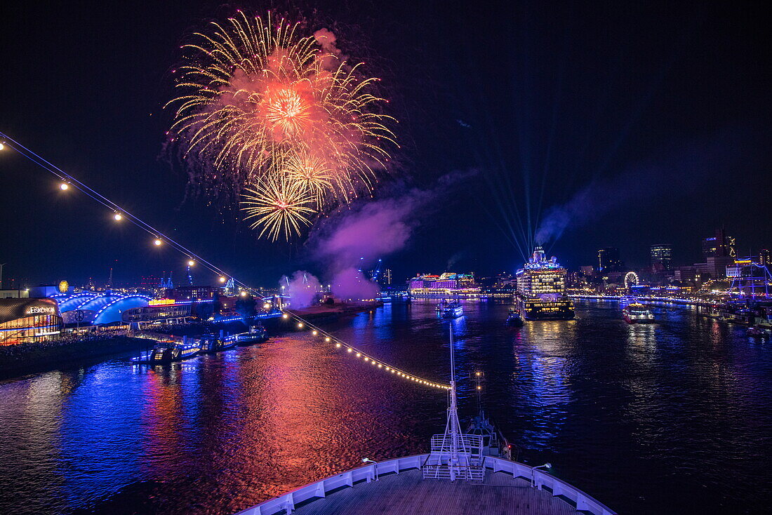 Bow of cruise ship Vasco da Gama (nicko cruises) with fireworks over the cruise ship Mein Schiff 6 (TUI Cruises) during the departure parade of the Hamburg Cruise Days 2023 at night, Hamburg, Hamburg, Germany