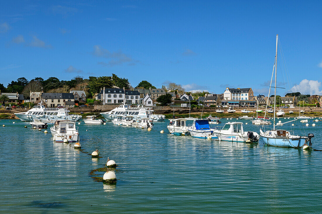 Village of Trégastel with boats in the foreground, Côte de Granit Rose, Brittany, France
