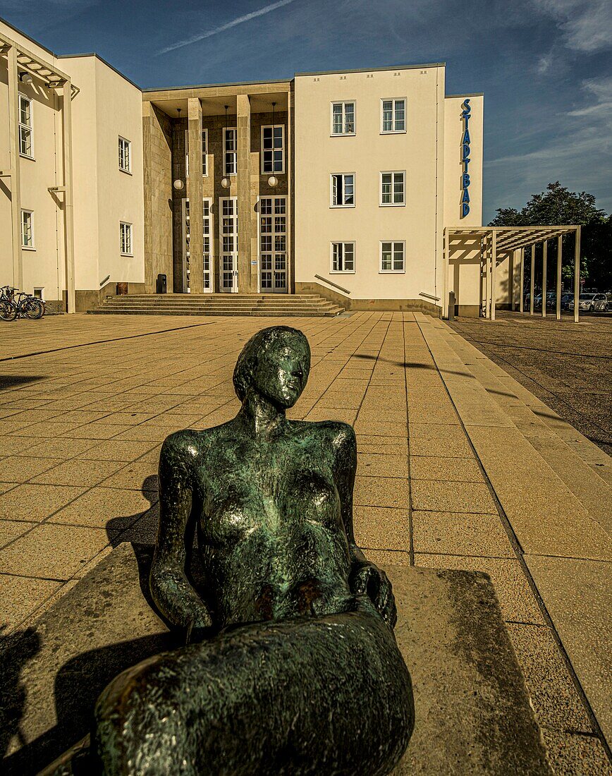 Sculpture in front of the New Building style municipal swimming pool in Chemnitz, Saxony, Germany