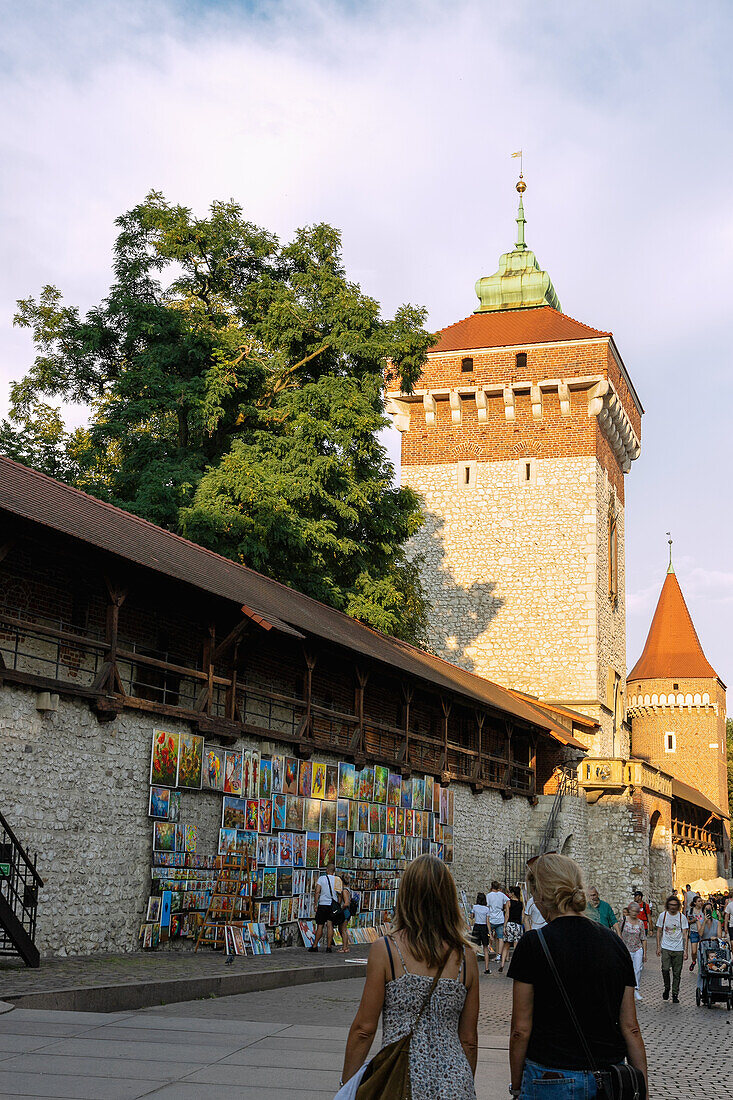 St. Florian's Gate (Brama Floriańska) and city wall with picture gallery in the old town of Kraków in Poland