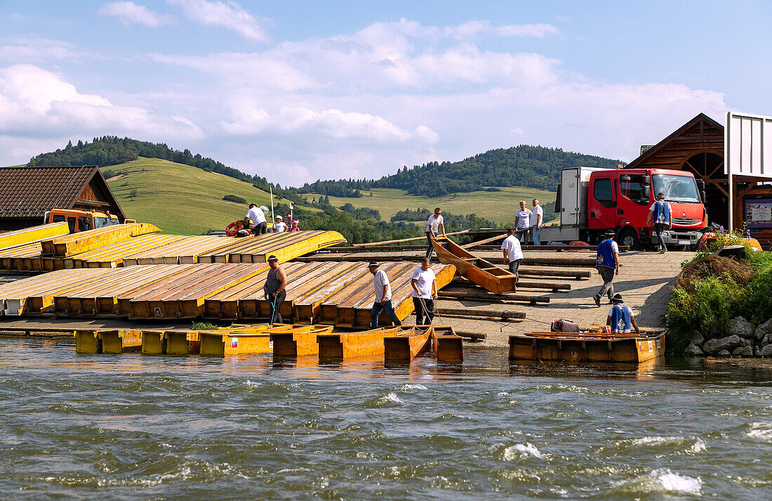 Rafting trip in the Dunajec Canyon in the Pieniny National Park (Pieninský Park Narodowy) in the Malopolskie Voivodeship in Poland with a view of the raft pier in Červený Kláštor in Slovakia