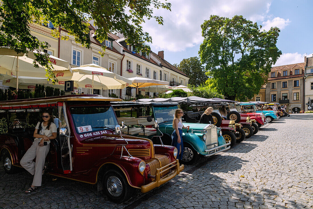 E-buses (Melexem) in a vintage look at Rynek in Sandomierz in the Podkarpackie Voivodeship in Poland