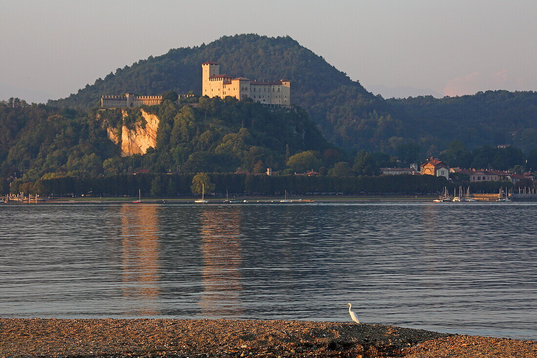 View from Arona over Lake Maggiore to the Rocca di Angera castle of the Visconti family, Angera, Lake Maggiore, Lombardy, Italy