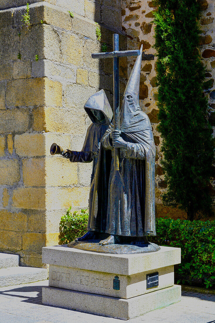 Caceres, Extremadura, penitent statue in the old town, in front of the cathedral still pure Middle Ages, Spain