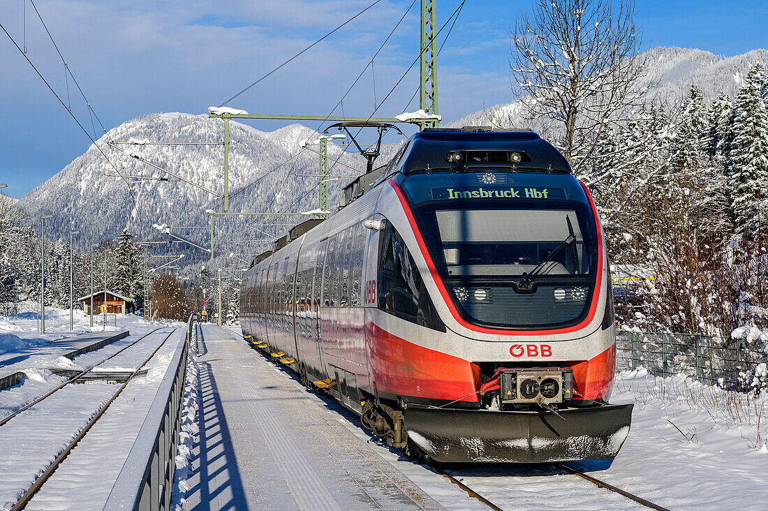 Train at the snowy Klais train station, Werdenfels, Upper Bavaria, Bavaria, Germany