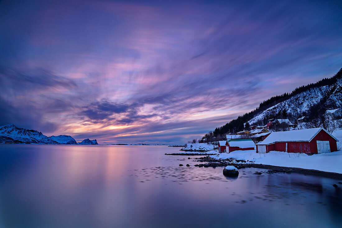 Evening mood over the mountains and fishermen's houses on the Nordfjord, Nordfjord, Skaland, Senja, Troms og Finnmark, Norway