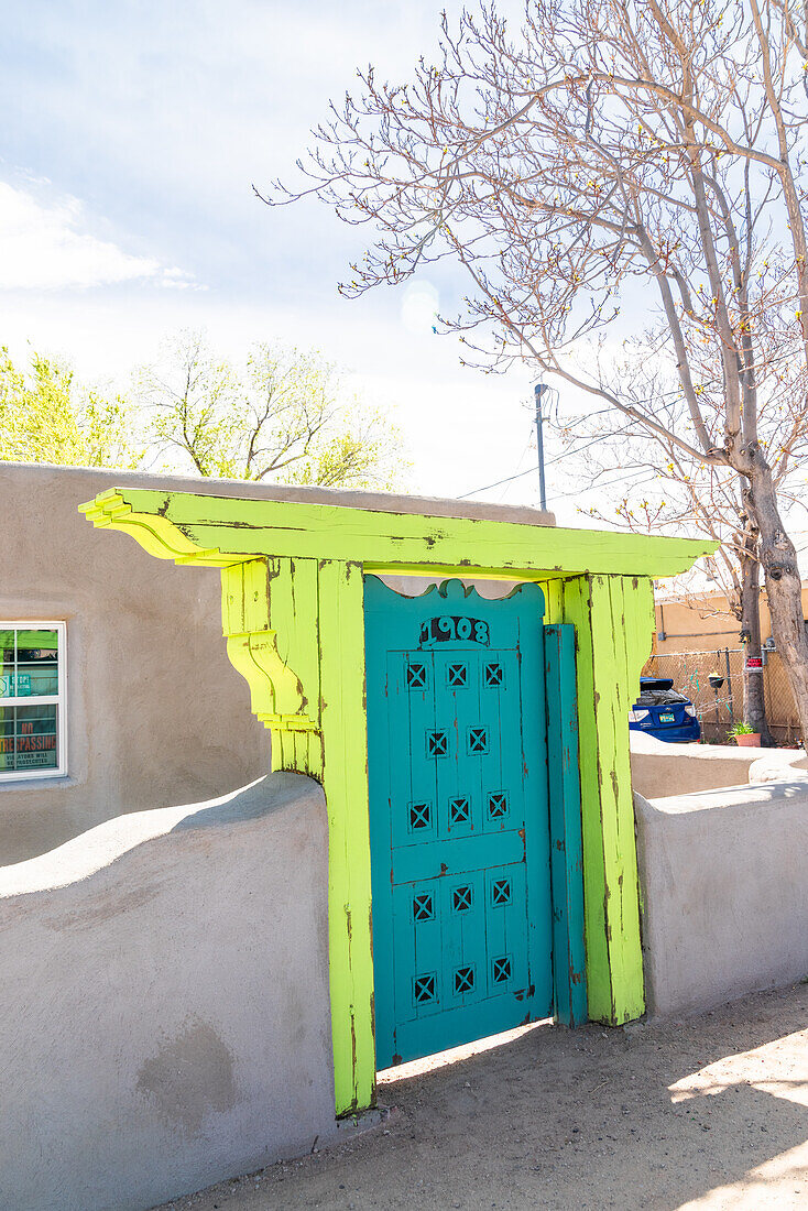 Brightly painted wooden ouside door in Albuquerque, New Mexico.