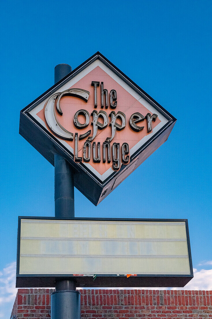 Old neon sign of a motel called The Copper Lounge in Albuquerque, New Mexico.