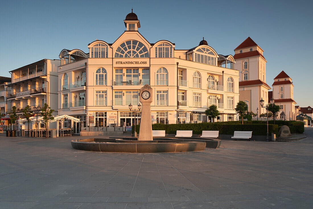 Beach castle, to the right of it Kurhaus Binz, illuminated by the morning sun, Binz, Rügen Island, Mecklenburg-Western Pomerania, Germany