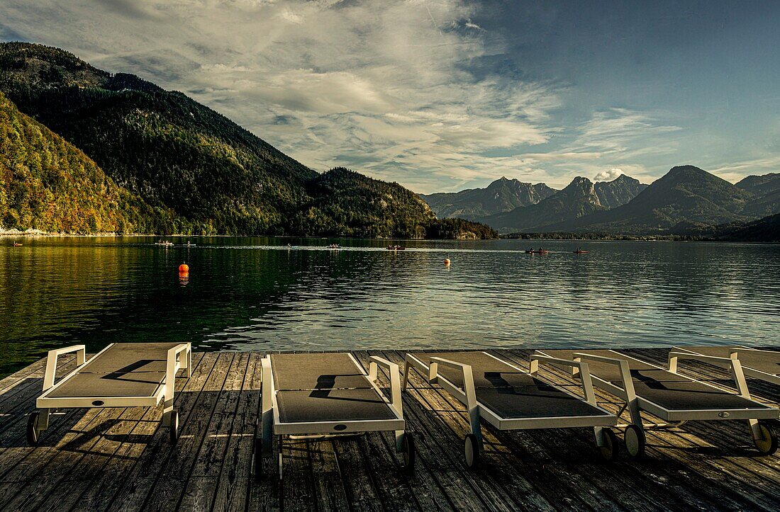 View from a bathing beach with sun loungers over Lake Wolfgangsee, St. Gilgen, Salzburg State, Austria