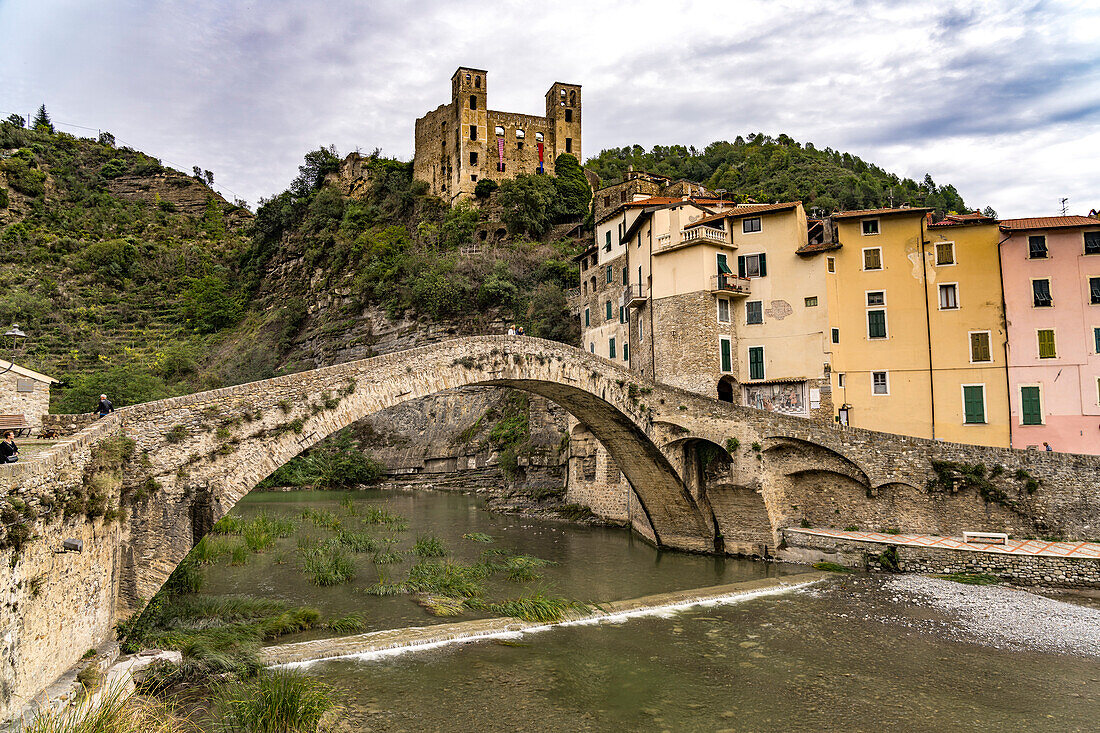 The old Nervia bridge Ponte Vecchio di Dolceacqua and the Castello dei Doria castle in Dolceacqua, Liguria, Italy, Europe