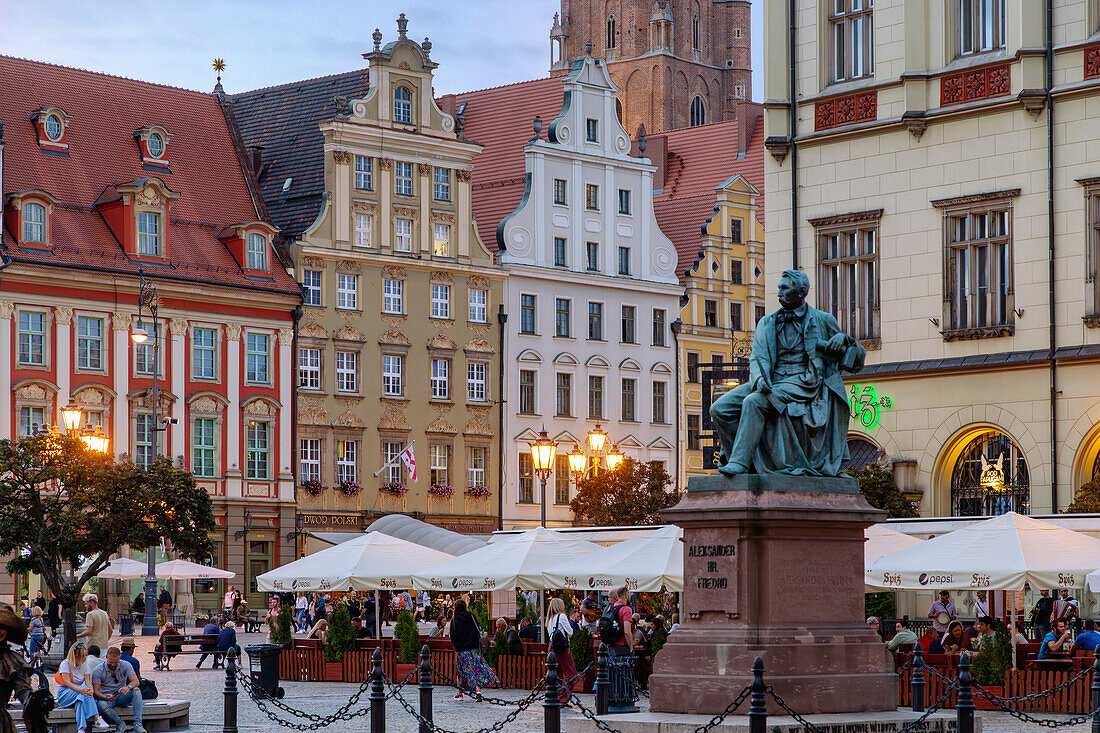 Rynek, Old Town Hall (Stary Ratusz) and Aleksander Fredro Monument (Monument Aleksander Fredro, Pomnik Aleksandra Fredry) in the evening light in the Old Town (Stare Miasto) of Wrocław (Wroclaw, Breslau) in Dolnośląskie Voivodeship of Poland