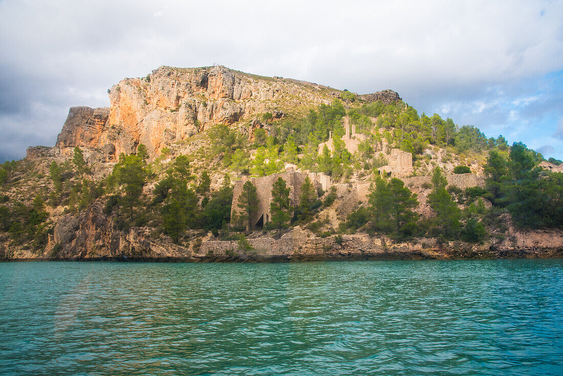 Boat tour on the Jucar reservoir, mountains and ancient ruins, from the Moorish period, Valencia province, Spain