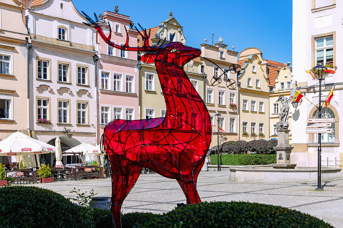 Town Hall Square (Rynek, Plac Ratuszowy) with red deer sculpture and Town Hall (Ratusz) in Jelenia Góra (Hirschberg) in the Giant Mountains (Karkonosze) in Dolnośląskie Voivodeship of Poland