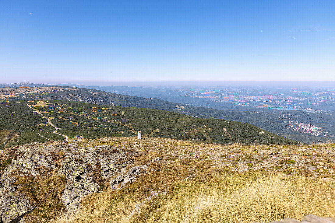 Mountain landscape and view towards Karpacz on the hiking trail to the summit of Sněžka (Śnieżka; Sniezka) in the Giant Mountains National Park (Karkonoski Park Narodowy) in the Dolnośląskie Voivodeship in Poland