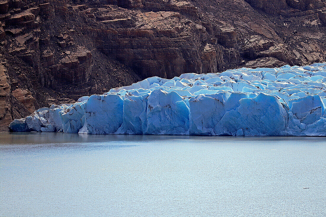 Chile; Southern Chile; Magallanes Region; Mountains of the southern Cordillera Patagonica; Torres del Paine National Park; Lake Grey; End of the eastern part of the glacier; blue glowing ice formation