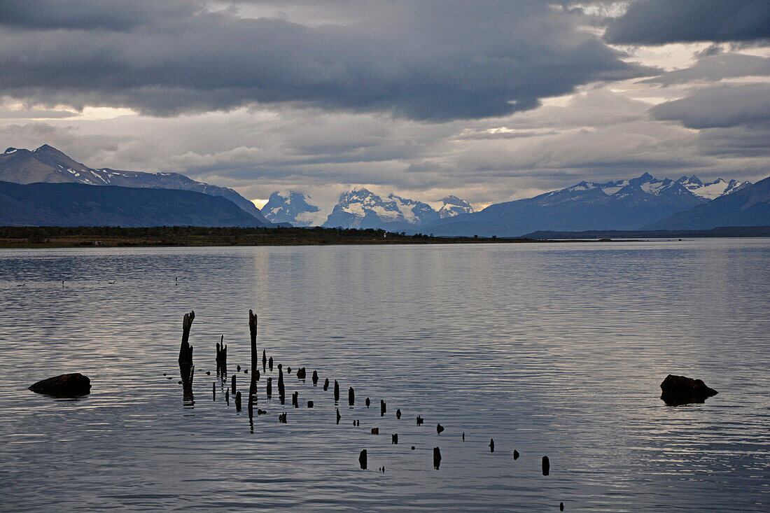 Chile; Southern Chile; Magallanes Region; Puerto Natales; historic pier at Seno de Ultima Esperanza; in the background the mountains of the southern Cordillera Patagonica