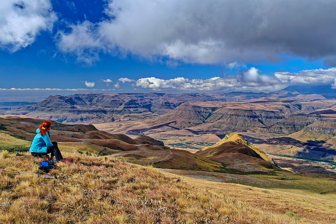 Woman hiking looks at Little Berg, Baboon Rock, Didima, Cathedral Peak, Drakensberg, Kwa Zulu Natal, UNESCO World Heritage Site Maloti-Drakensberg, South Africa