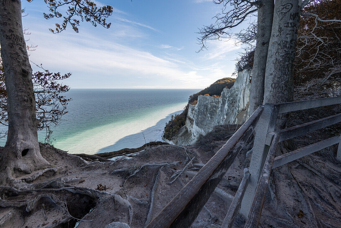 Steep coast of Møns Klint, chalk cliffs, white water of the Baltic Sea through washed-out chalk after storm surge, Mön Island, Denmark