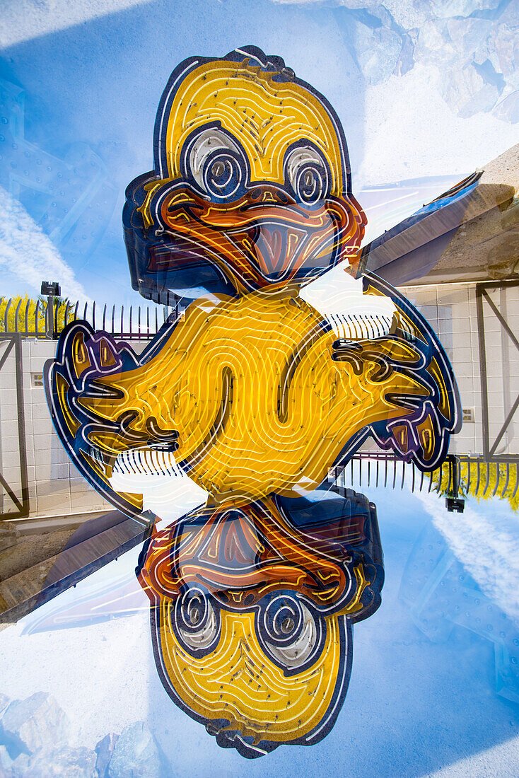 Double exposure of abandoned and discarded neon Duck sign in the Neon Museum aka Neon boneyard in Las Vegas, Nevada.
