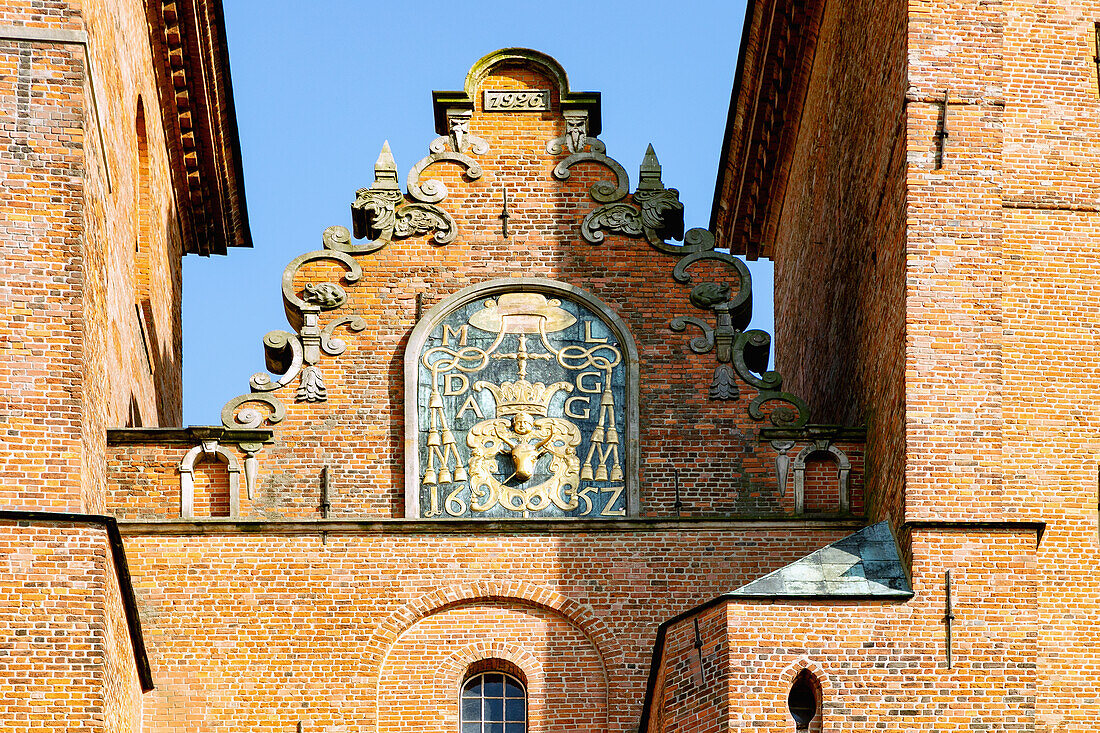 Decorative pediment and coat of arms of Archbishop Maciej Łubieński Herb Pomian at the Cathedral of the Assumption and St. Adalbert (Gniezno Cathedral; Archcathedral of Gniezno; Primate's Basilica of the Assumption of Our Lady; Bazylika archikatedralna Wniebowzięcia NMP) in Gniezno (Gniezno) in Wielkopolska Voivodeship in Poland