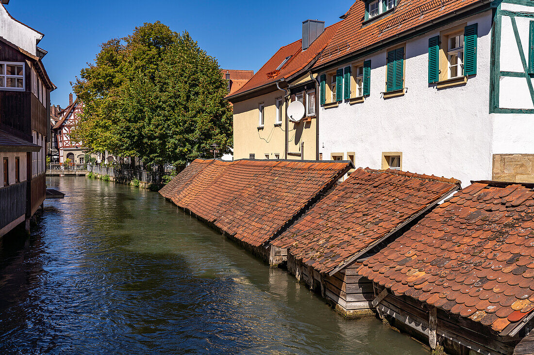  Wooden fish boxes on the Wiesent in Forchheim, Upper Franconia, Bavaria, Germany  