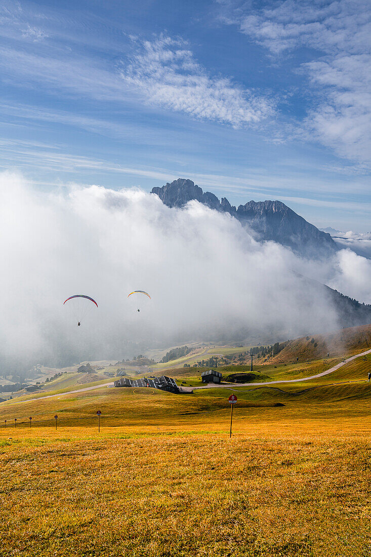 Paragliders at the Seceda in autumn, Val Gardena, Bolzano, South Tyrol, Italy