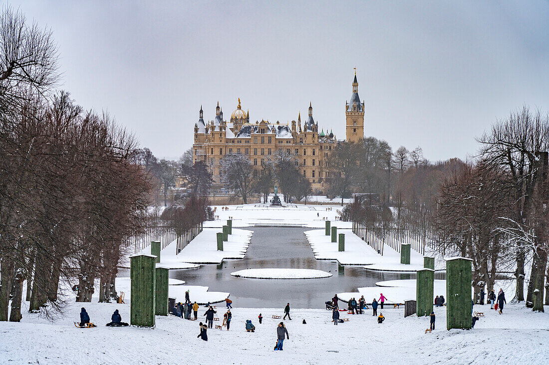  The snow-covered castle garden and Schwerin Castle in winter, state capital Schwerin, Mecklenburg-Western Pomerania, Germany\n\n 
