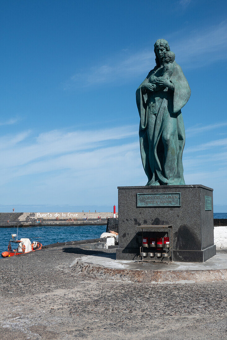 Virgen del Carmen, statue of the patron saint of the Canary Islands, also revered by sailors as Stella Maris, in the harbor of Purto de la Cruz, Tenerife, Canary Islands Spain