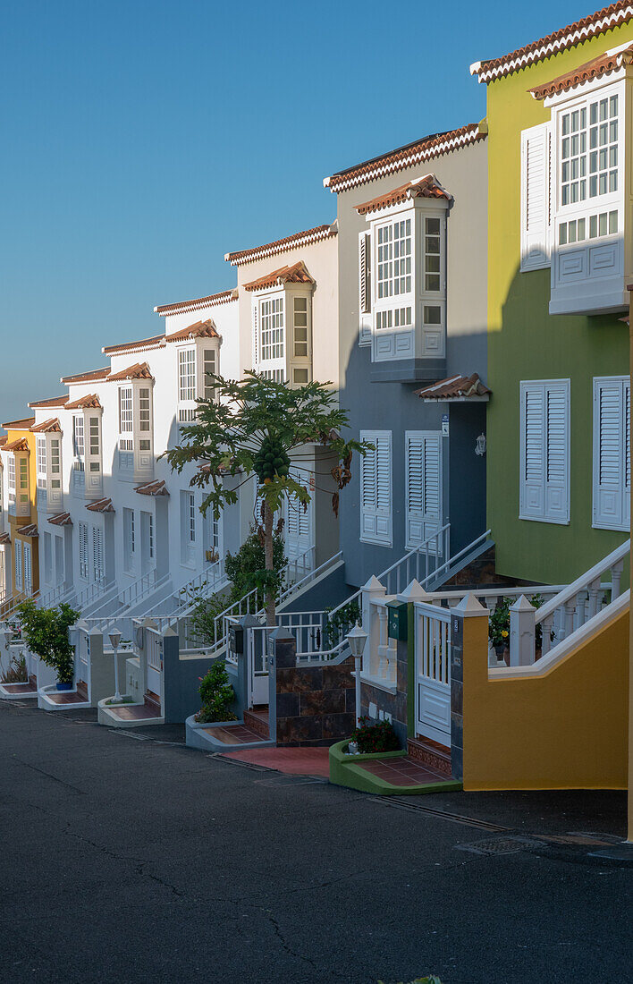 Orotava; modern row of terraced houses with traditional style elements such as bay windows and lattice windows, Tenerife, Canary Islands, Spain