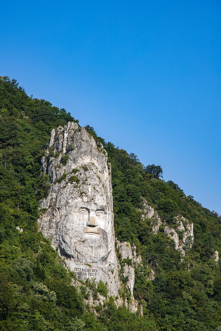 The 40 m high rock sculpture of Decebalus in the Iron Gates Gorge on the Danube, near Drobeta Turnu-Severin, Mehedinți, Romania, Europe