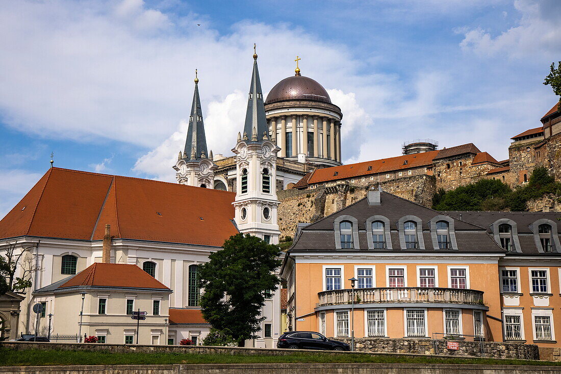 Church and buildings in the old town with Esztergom Cathedral on hill, Esztergom, Komárom-Esztergom, Hungary, Europe