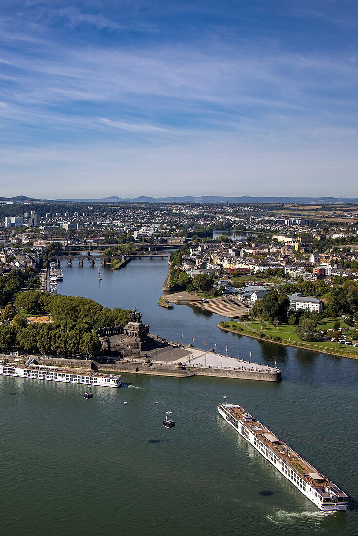 River cruise ship Viking Gersemi (Viking Cruises) maneuvers in front of Deutsches Eck at the confluence of the Moselle and Rhine, seen from Ehrenbreitstein Fortress, Koblenz, Rhineland-Palatinate, Germany, Europe