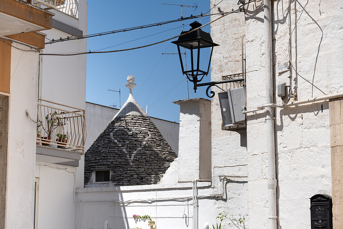 View of a trulli roof with heart, typical buildings of Alberobello (Unesco World Heritage Site) in summer, Alberobello municipality, Bari province, Apulia region, Italy, Europe