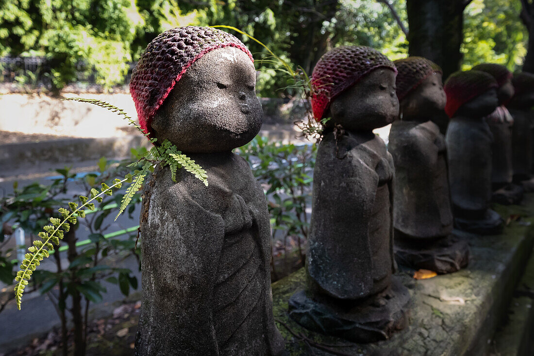 View of Jizo statues (Kosodate Jizo-son) guardian deity of children, Zojoji Temple, Tokyo, Japan, Asia