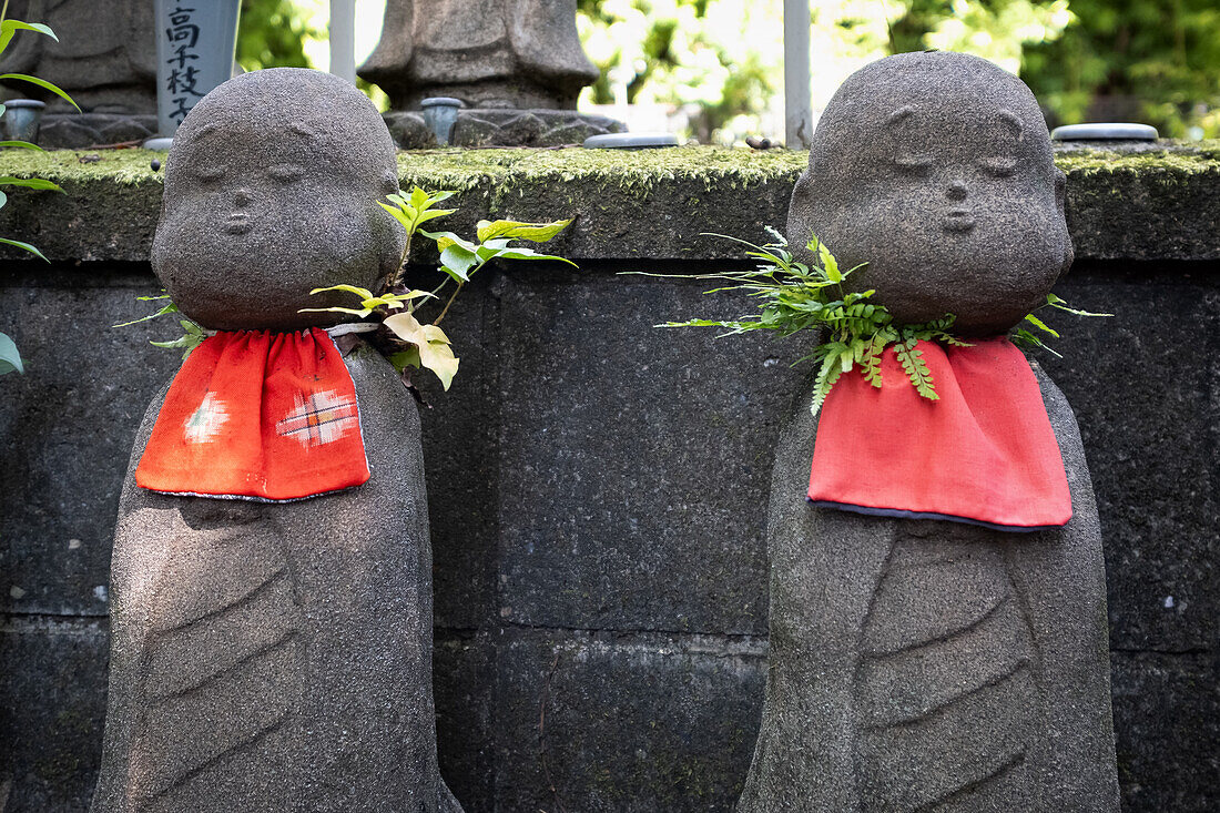 View of Jizo statues (Kosodate Jizo-son) guardian deity of children, Zojoji Temple, Tokyo, Japan, Asia