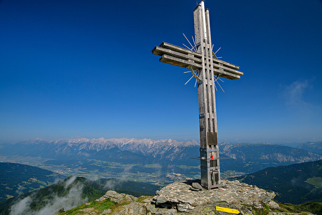Summit cross of the Guffert, with a view of the Inntal and Karwendel, Guffert, Hochfügen, Zillertal, Tux Alps, Tyrol, Austria