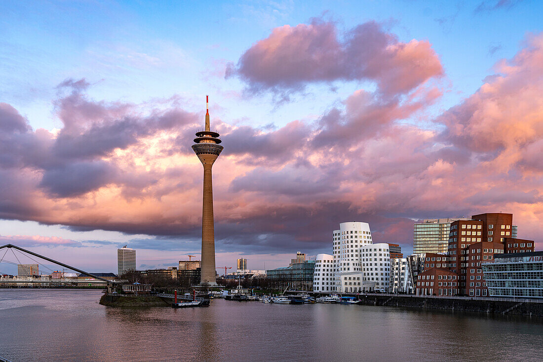  Gehry buildings - Neuer Zollhof at the Media Harbor and the Rhine Tower in Düsseldorf, North Rhine-Westphalia, Germany 
