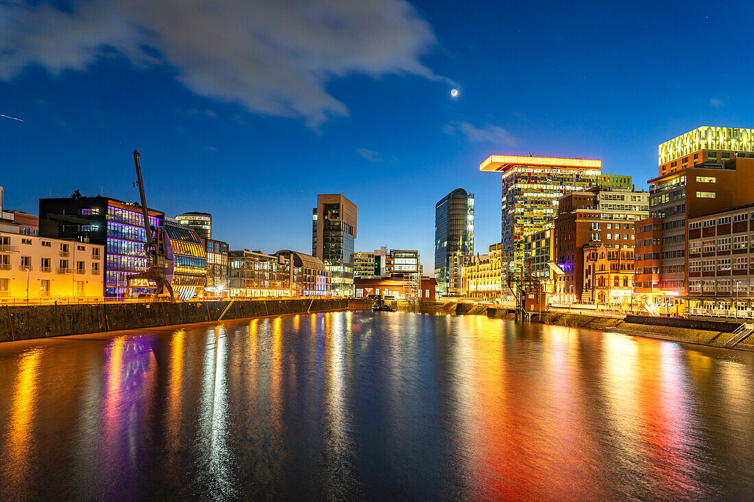  Modern high-rise architecture at the Medienhafen district in Düsseldorf at dusk, North Rhine-Westphalia, Germany, Europe  