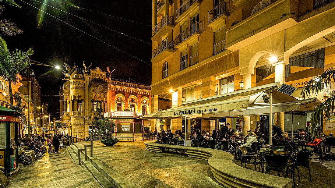  Evening atmosphere on the Plaza de los Reyes with terrace cafe and the Casa de los Dragones, Ceuta, North African coast, Strait of Gibraltar, Spain 