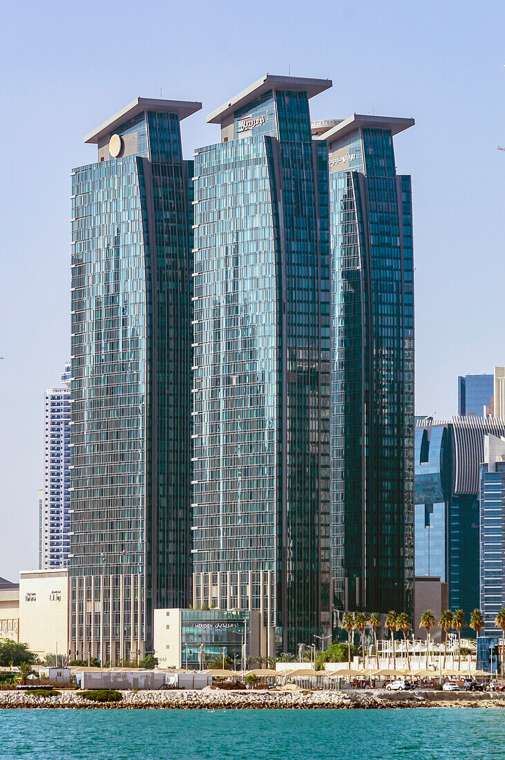  Harbor views with skyscrapers and ships in Doha, capital of Qatar in the Persian Gulf. 