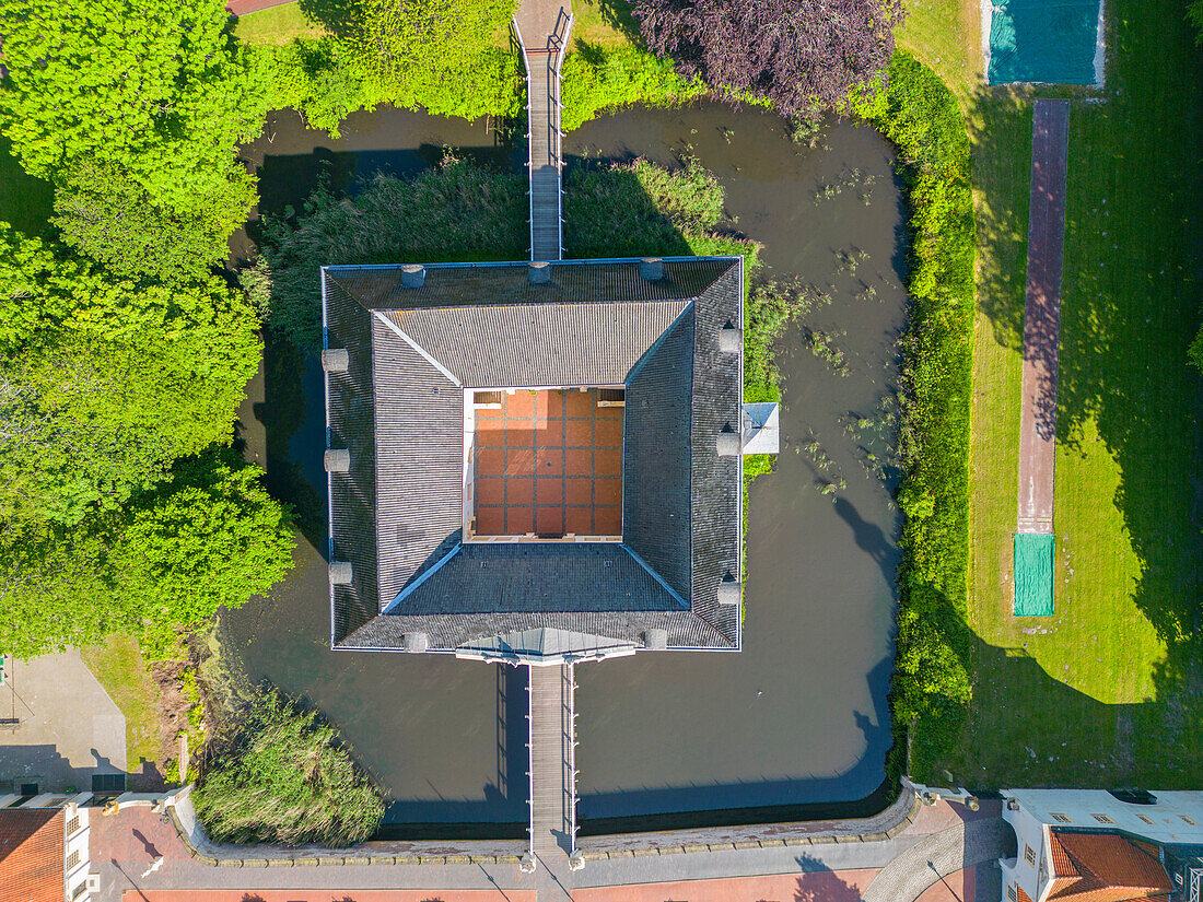  Aerial view of the Norderburg moated castle in Dornum, East Frisia, Lower Saxony, Germany 