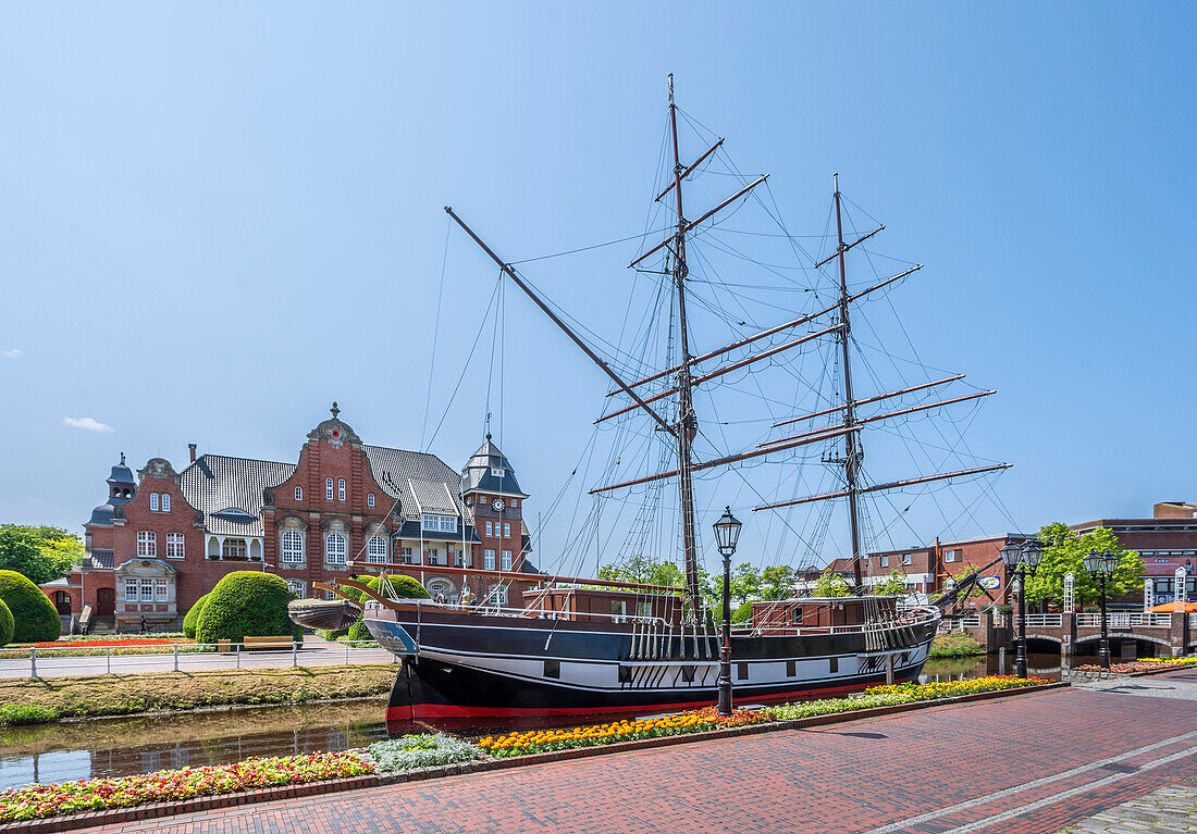  Main canal with sailing ship Friederike von Papenburg with town hall, Emsland, Lower Saxony, Germany 
