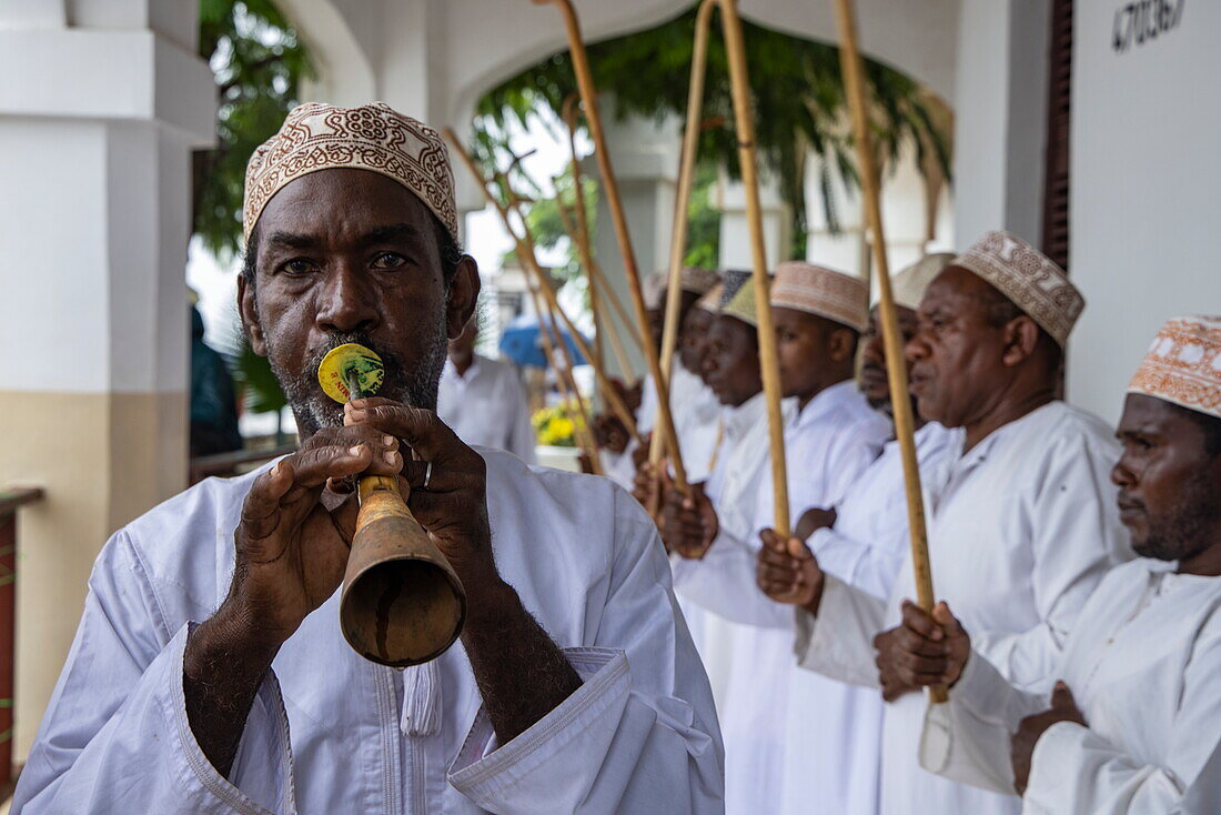  Traditional music is performed by men welcoming passengers on the expedition cruise ship SH Diana (Swan Hellenic), Lamu, Lamu Island, Kenya, Africa 