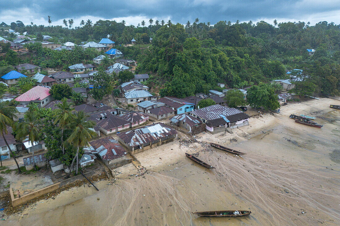  Aerial view of canoes on beach at low tide with village, Mkoani, South Pemba, Pemba Island, Tanzania, Africa 