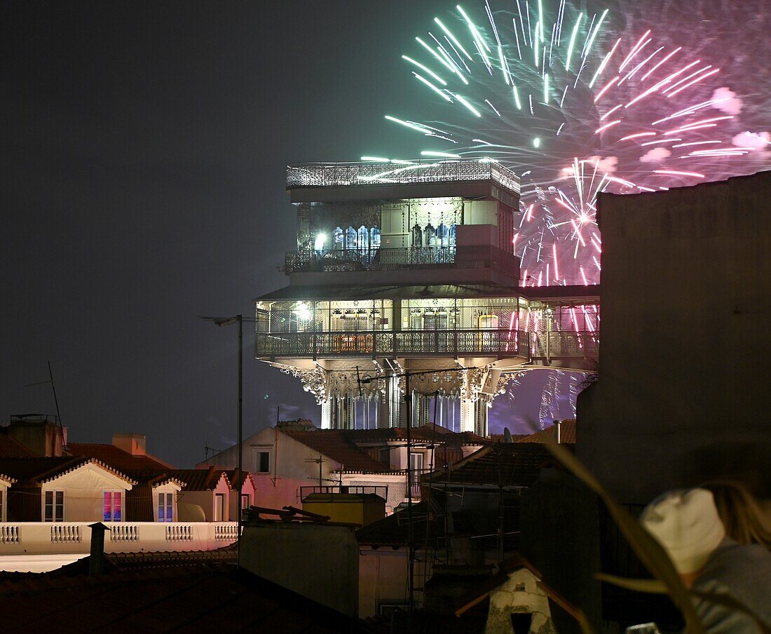  New Year&#39;s Eve fireworks with Elevador Santa Justa viewpoint over Lisbon, Portugal 