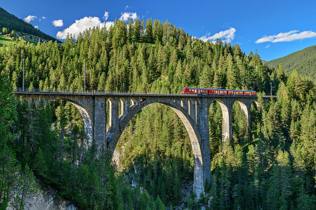  Train travels over Wiesen Viaduct, Rhaetian Railway, Davos, Silvretta, Graubünden, Switzerland 