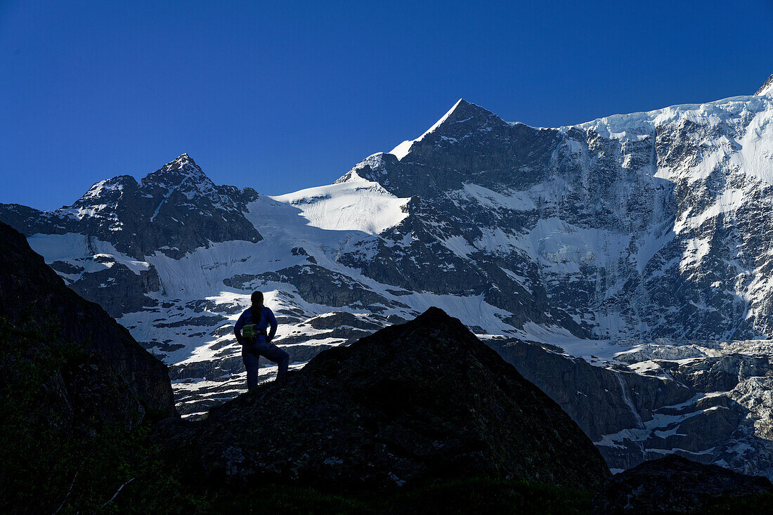  Hiker in front of the Ochs, Bernese Oberland, Grindelwald, Switzerland. 