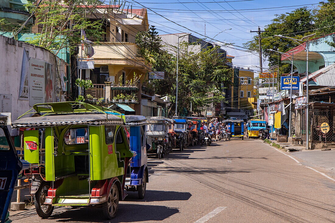  Colorful tricycle rickshaws on the street, Coron, Palawan, Philippines 